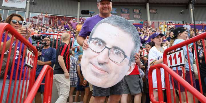 John Oliver auctioning Erie Moon Mammoths gear