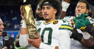 Love matches career high with 4 TD passes, lifting Packers to a win over Lions