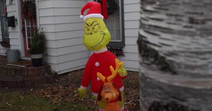Osseo police pitch in to help family after teens steal Grinch inflatable from their yard