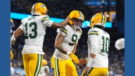 Love matches career high with 4 TD passes, lifting Packers to 31