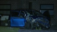 Two people on the run after car crashes into Sydney home