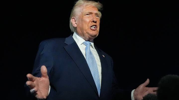 Trump defends Tucker Carlson after interview with activist known for his antisemitic views