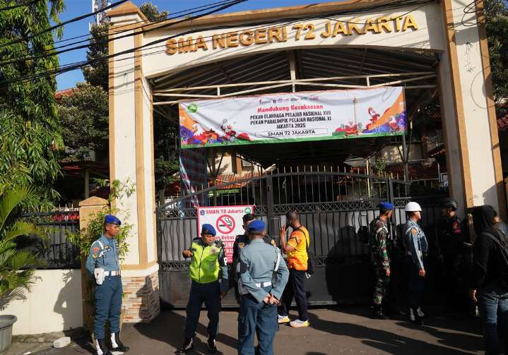 Multiple explosions shake a mosque in an Indonesian high school and injure 55