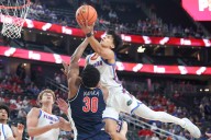 Freshman Koa Peat leads No. 13 Arizona to 93-87 win over defending champion, No. 3 Florida