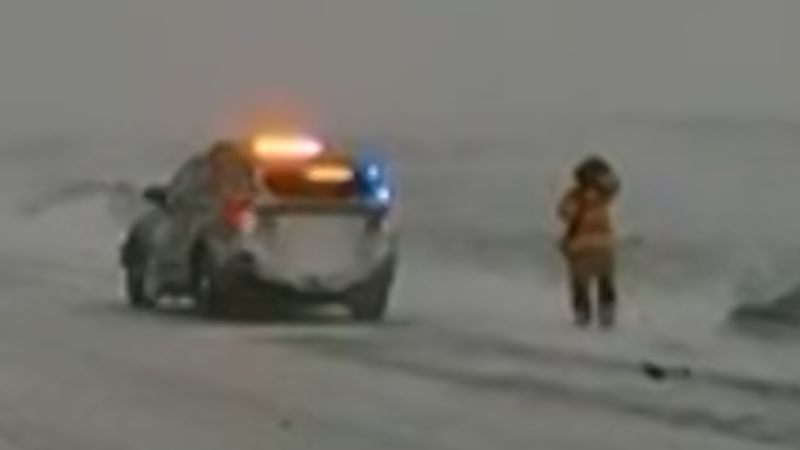 Truck narrowly avoids state trooper in winter storm