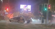 Moment bulldozer rampages through city centre in two-and-a