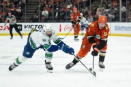 Ducks edged by Canucks on a pair of late goals