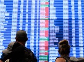 Mass delays and stranded travelers: Photos capture airport chaos amid the longest government shutdown in US history