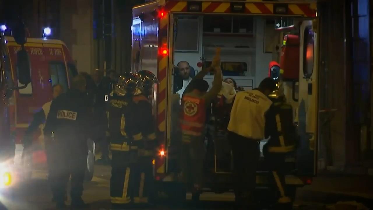 France honors victims 10 years after attacks at Bataclan concert hall, cafes and national stadium