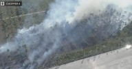 West Miami-Dade brush fire has crews rushing to extinguish growing blaze