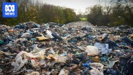 Authorities look to underworld for answers after massive illegal rubbish dump sparks outcry in England
