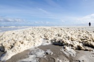 Kids play in ocean foam that flooded Dublin neighborhood streets