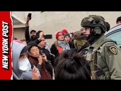 People Protest Federal Agent During Search Warrant