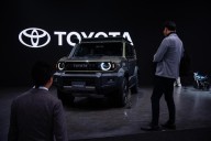Toyota reports profit drop as Trump's taxes hurt Japanese automakers