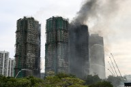 Hong Kong fire death toll rises to 55 people with fires still burning, officials say