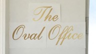 New gold script sign appears outside Oval Office