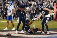 UConn football survives with late strip sack to seal 37