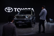 Japan’s Toyota, hurt by President Trump’s tariffs, reports a drop in profit