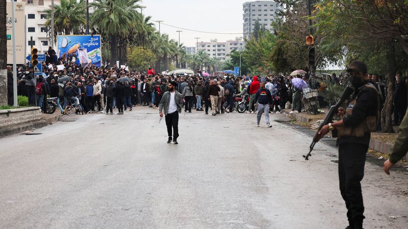 Syrian security forces use gunfire to disperse rival protests in Alawite heartland