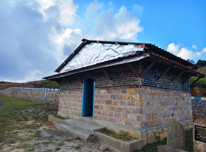 Community efforts convert plastic trash to tourist shed