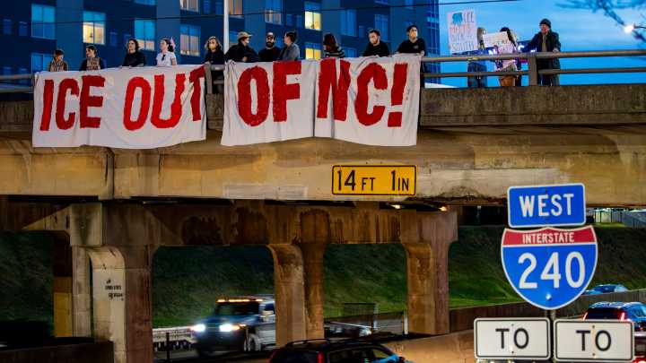 Photos: Protest on Montford Avenue bridge over ICE raids