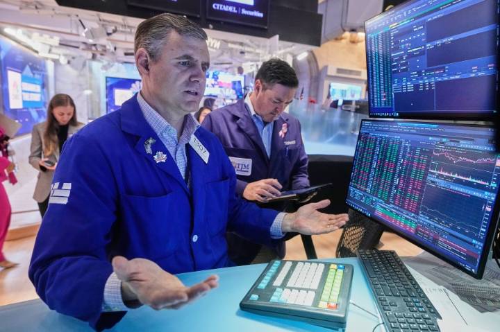 Wall Street gains ground amid steady flow of earnings reports, upbeat economic updates