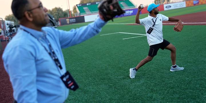 Cincinnati Reds great Barry Larkin brings baseball to the Middle East, with camels carting in relief pitchers from the bullpen