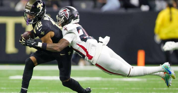 After injuring his back, WR Chris Olave was not present for Saints practice on Thursday