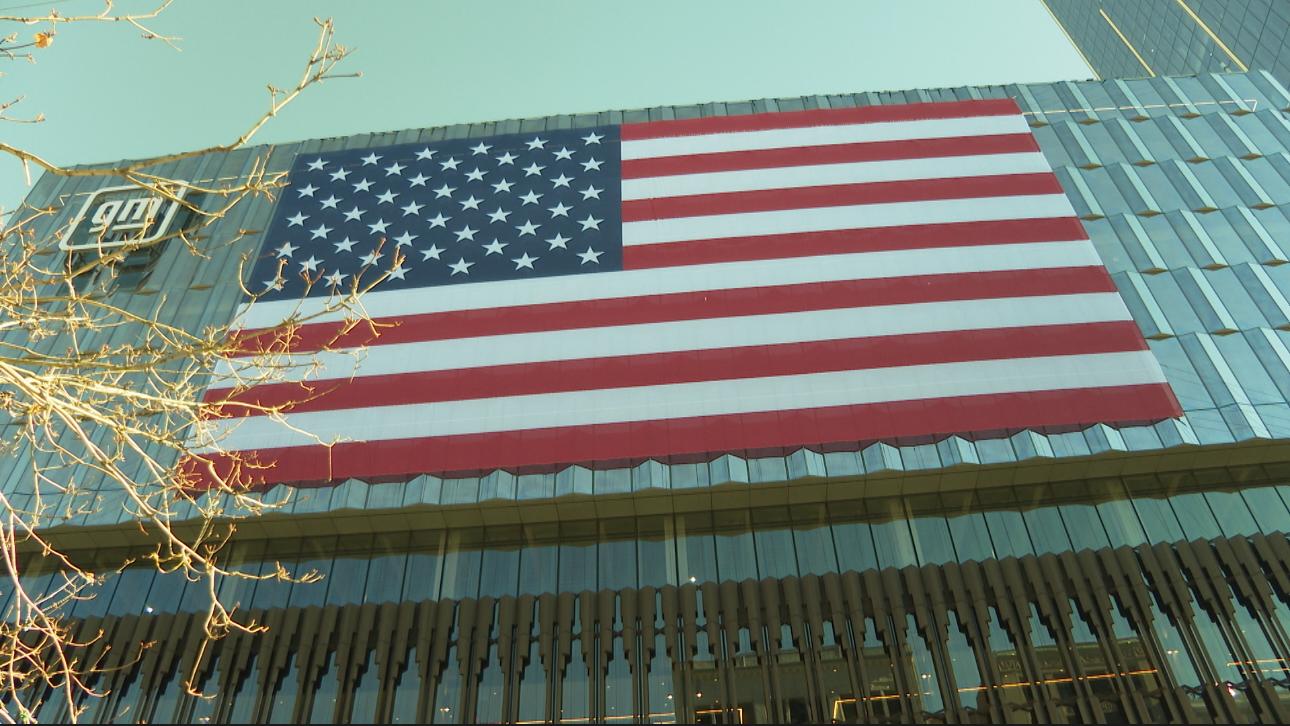 Crews unfurl massive American flag on side of new Hudson’s building in Detroit