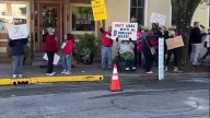 Anti-redistricting protesters station outside Indiana governor's luncheon in New Albany