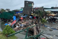 Typhoon Fung-wong blows away from the Philippines, leaving 10 dead and 1.4 million displaced