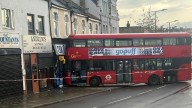 Double decker bus filled with passengers crashes into shop in London