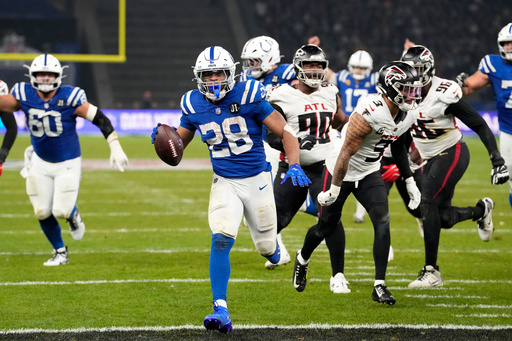Taylor runs for 244 yards and 3 TDs for Colts in 31-25 OT win over Falcons in Berlin