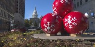 Big red ornaments return to downtown Lansing