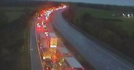 Major motorway closed after lorry crash sees vehicle bursts into flames in rush hour chaos