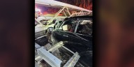 Overhead sign falls on car, traps driver on Charlotte interstate