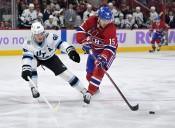 Deadspin | Canadiens F Alex Newhook helped off ice after collision with boards