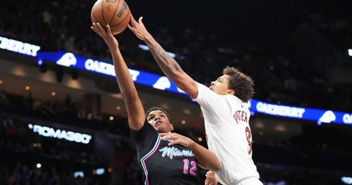 Short-handed Cavs rally to beat Heat