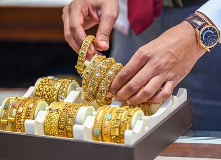 Gold rebounds from one-week low as dollar index slips