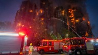 At least 13 killed after massive fire engulfs residential complex in Hong Kong