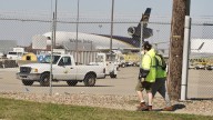 Search for victims, answers continues at site of UPS plane crash