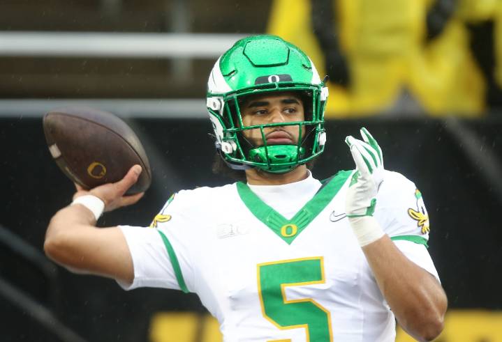 Oregon keeps College Football Playoff hopes alive in rain