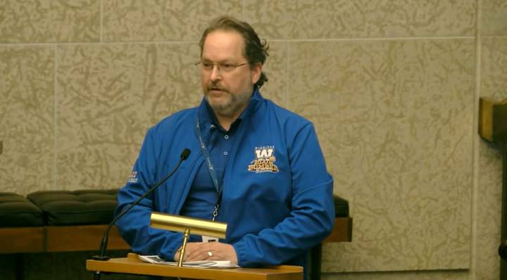 City debates five-year parking plan