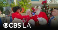 Sheba Turk talks with Santa and Mrs. Claus