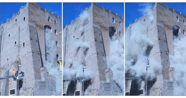 Rescuers work to reach worker trapped in medieval tower that partially collapsed in Rome