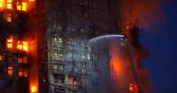 13 people killed in fire engulfing Hong Kong high-rise residential buildings, fire services say