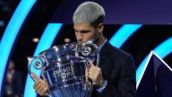 Carlos Alcaraz beams with pride as he lifts trophy for year