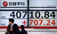 Asian shares sink, tracking tech