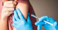 NHS urges eligible people to take free flu jab amid sharp rise in cases