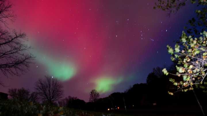 See the northern lights shine on the outskirts of Iowa City